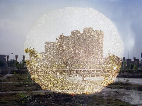 A chemically-altered print by Curtis Mann titled 'New Monument.' Mann frequently strips a layer of color from found images, leaving ghostly shapes in their wake.